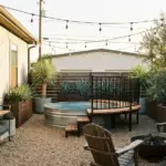 Rustic industrial stock tank pool ideas with cedar deck, gravel pad, black accents, and modern above ground pool styling