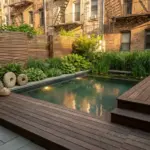 Small space natural pool in an urban garden with plunge pool design, layered planting, wood decking, and modern organic landscaping