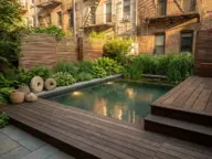 Small space natural pool in an urban garden with plunge pool design, layered planting, wood decking, and modern organic landscaping