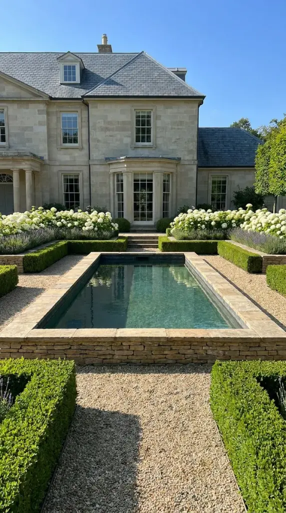 Formal garden natural pool with symmetrical landscaping, clipped hedges, and elegant eco-friendly pool design