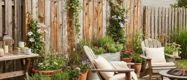 DIY cedar fence picket hack backyard makeover one year later with budget privacy screen and planters