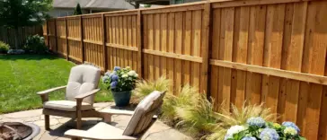 Shadowbox fence for backyard privacy and airflow with cedar boards, alternating pickets, and breezy landscaping