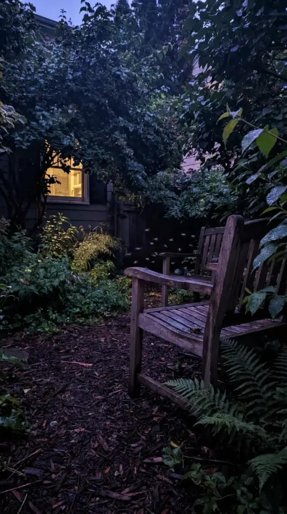 Mosquitoes gathering in a damp shaded backyard after dark during peak evening mosquito activity