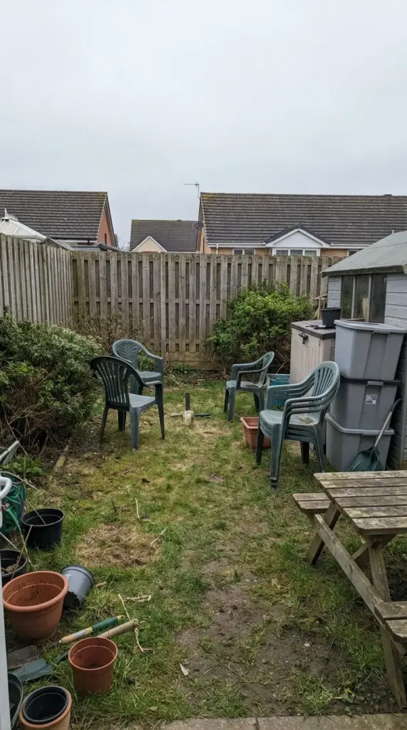 backyard before photo with no privacy screen and unfinished outdoor design