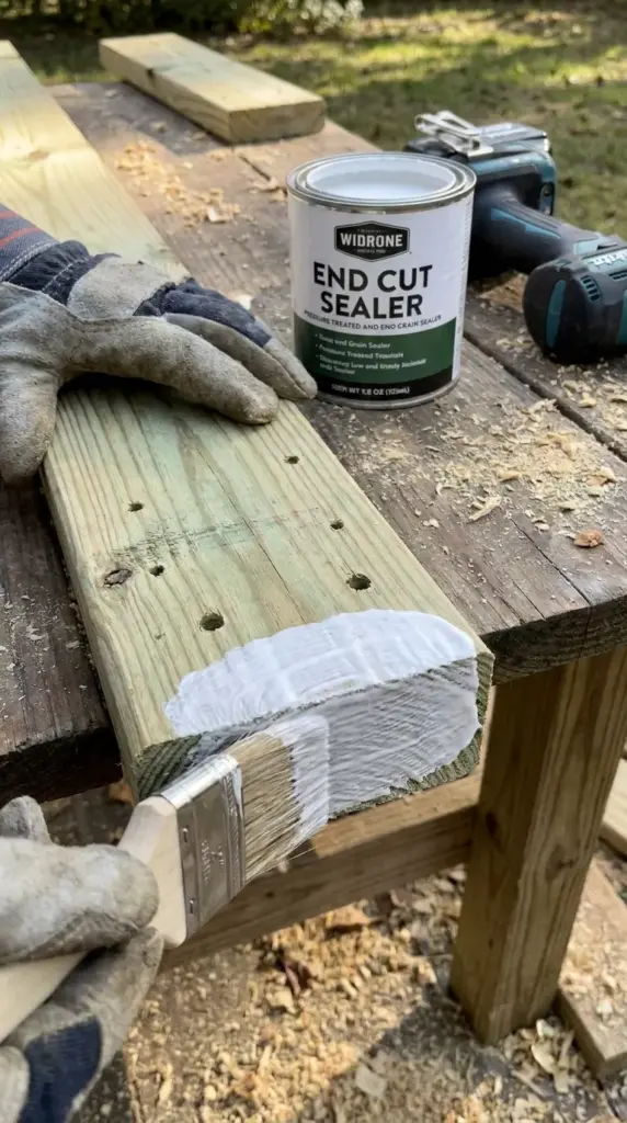 Sealing cut ends of pressure-treated lumber to prevent fence rot and moisture damage