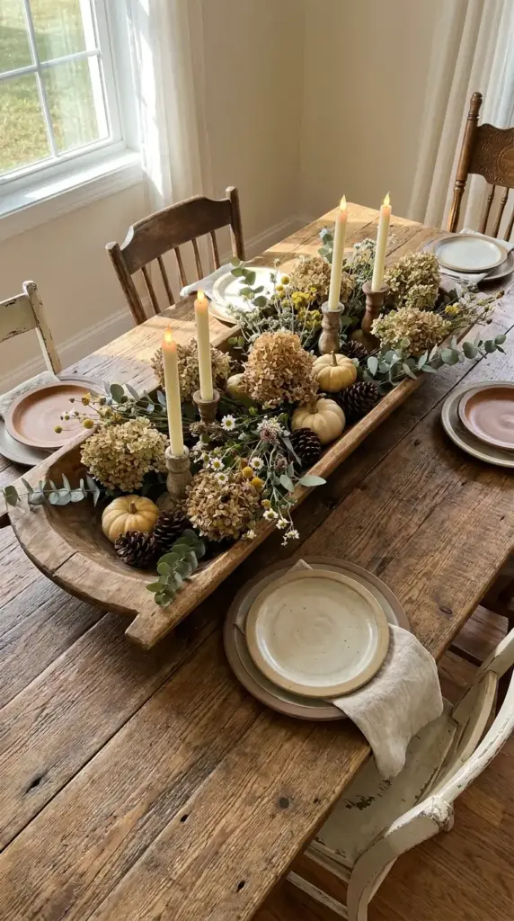 Farmhouse dough bowl centerpiece with hydrangeas, eucalyptus, and wildflowers for table decor