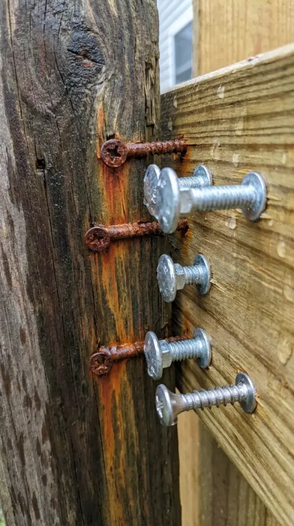 Rusty fence screws versus galvanized and stainless steel fasteners for treated wood fence durability
