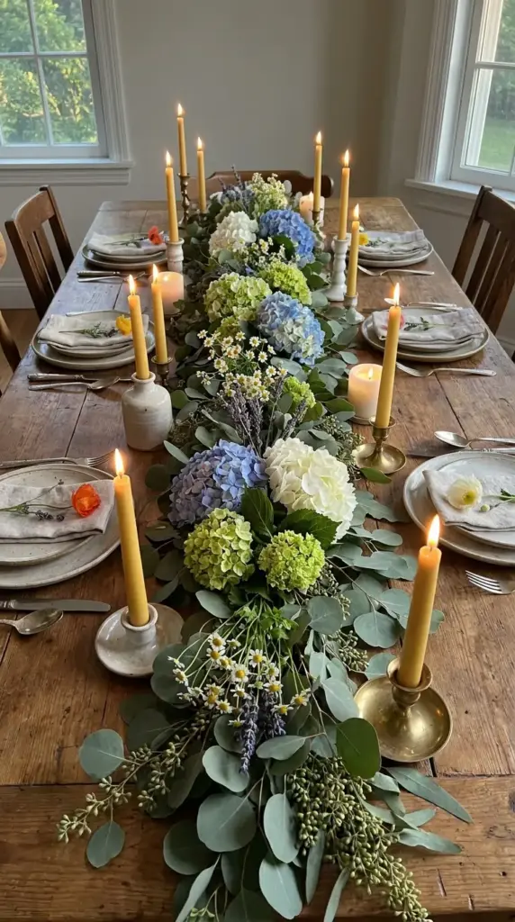 Eucalyptus garland with hydrangea nests and wildflowers for a natural table runner centerpiece