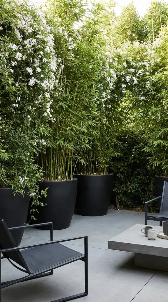 Vertical garden privacy planters forming a living wall border around an uncovered outdoor space.