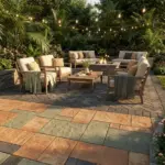 Beautiful expensive looking patio ideas with pavers in a lush backyard garden setting.